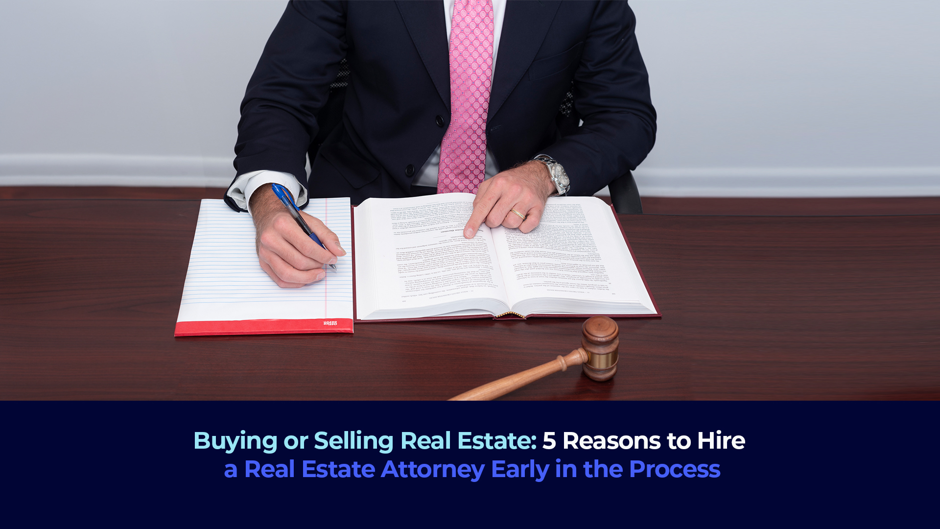 A picture of a lawyer writing a document and the title "Buying or Selling Real Estate: 5 Reasons to Hire a Real Estate Attorney Early in the Process"