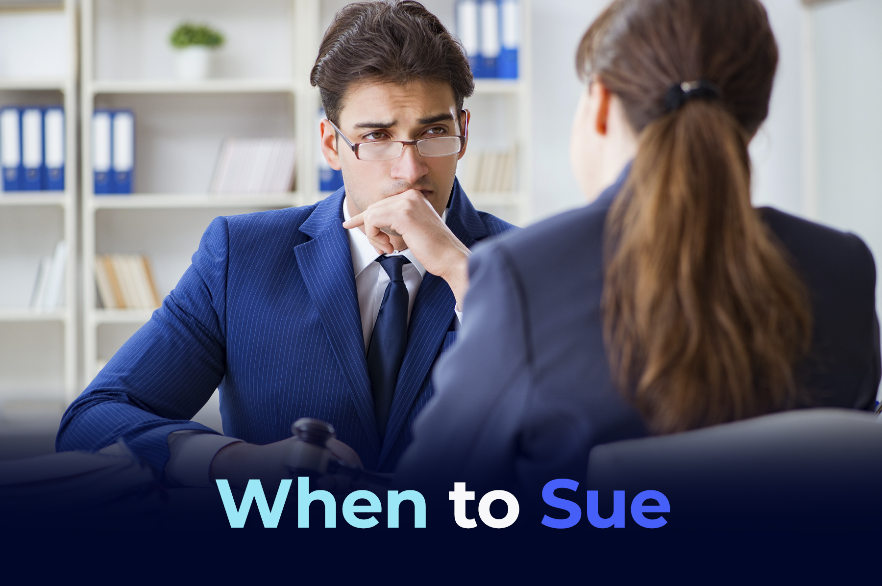 A lawyer and a client sitting in a office talking with the title "When to Sue"