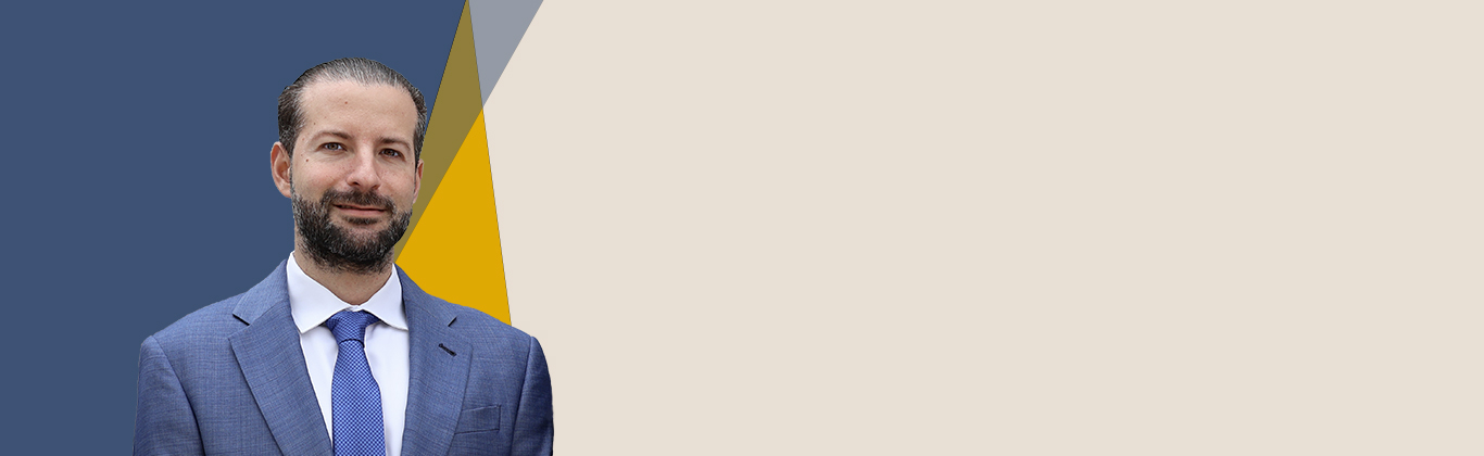 Burton Landau, founder partner at South Florida Law PLLC, a blue, gray, yellow and beige background color in this picture.